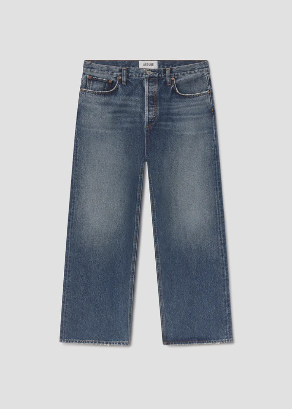 A pair of medium-wash blue denim jeans with a straight-leg fit, shown flat against a light gray background.