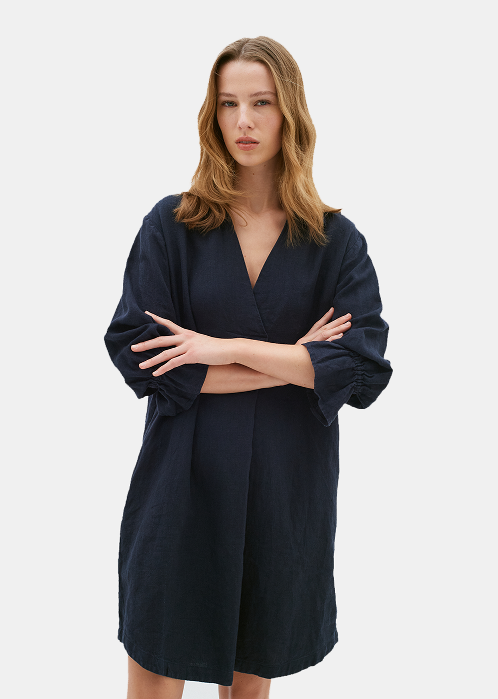 Front view of model wearing the Peg Linen Dress by InWear, showcasing the loose fit and v-neck neckline.