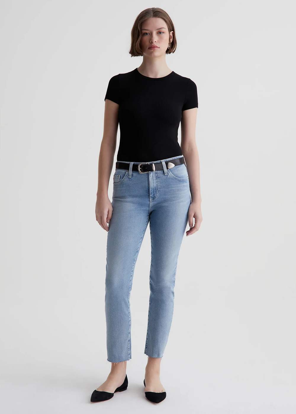Zoomed out front view of the Mari Crop Jeans by AG Jeans showcasing the high-rise slim straight fit that's cropped just above the ankle.