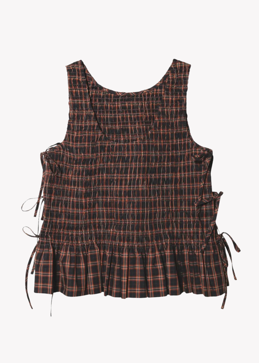 A sleeveless smocked top with a dark brown and black plaid pattern, featuring side tie details and a ruffled hem, shown against a plain light gray background.