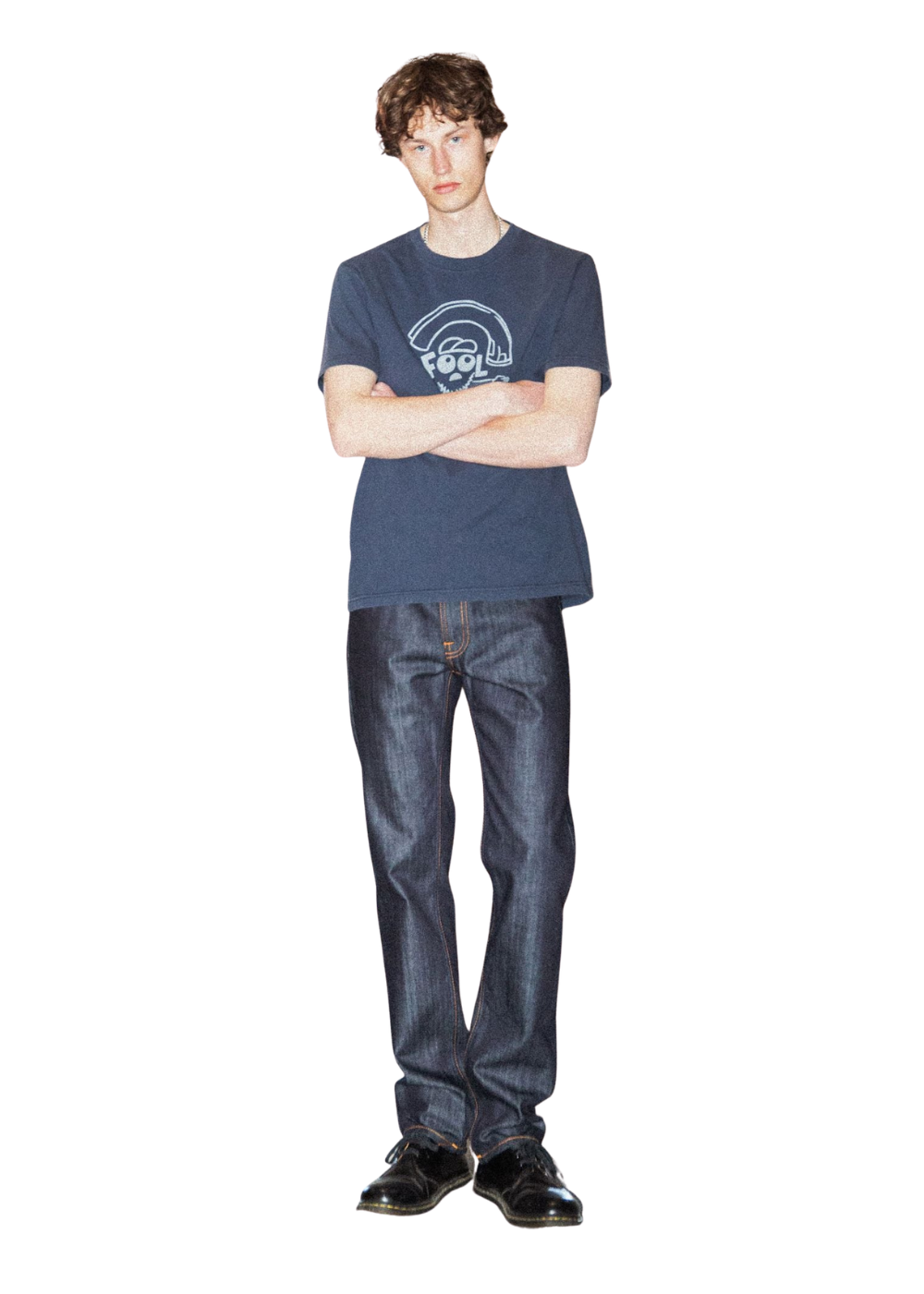 A man modeling a dark blue crewneck t-shirt with a white graphic print on the chest, paired with dark blue jeans and black shoes, standing against a solid white background.