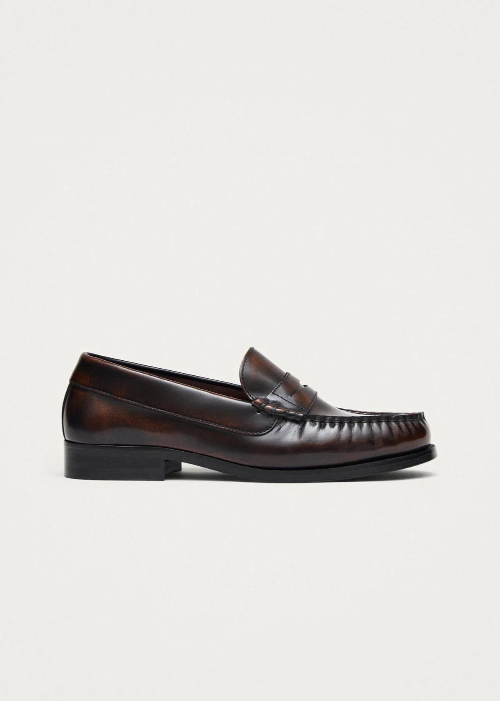 Brown loafer shoe on a white background