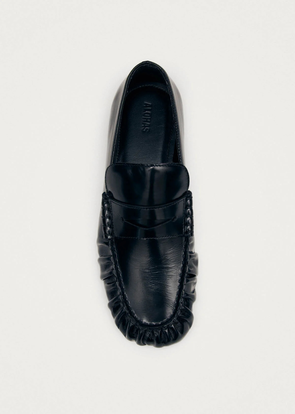 Black loafer shoe on a white background