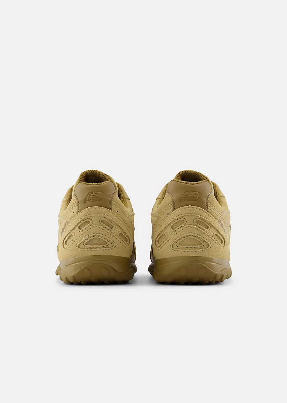 A pair of tan suede sneakers shown from the back, featuring matching tan soles and embossed detailing, set against a plain light gray background.