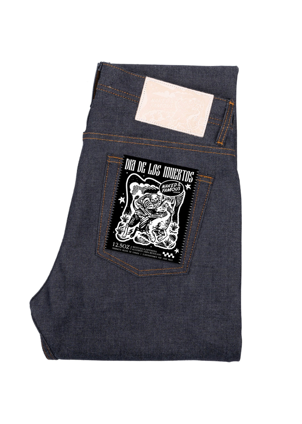Folded dark blue denim jeans with a Naked and Famous Denim logo on the pocket against a white background
