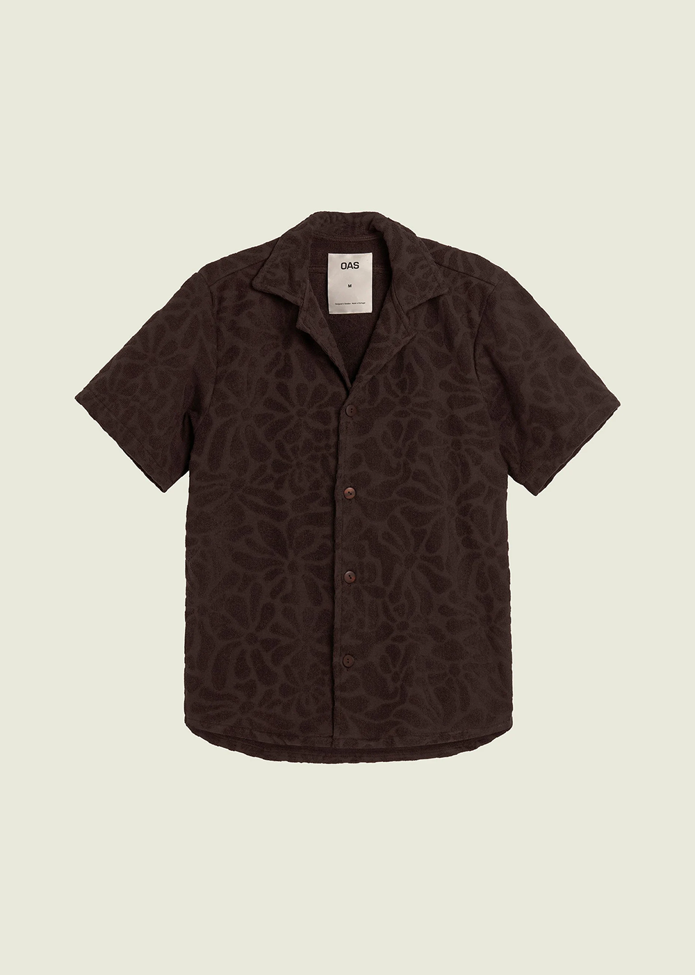Front view of Blossom Terry Shirt by OAS Company in faded black with a flower blossom design.
