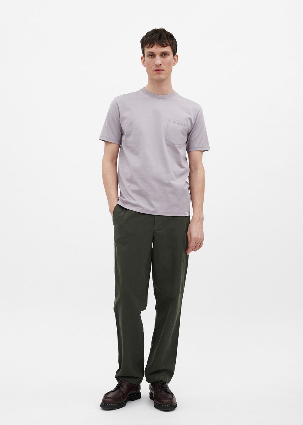 Front view of a model wearing the Johannes Organic Pocket T-Shirt in crocus purple