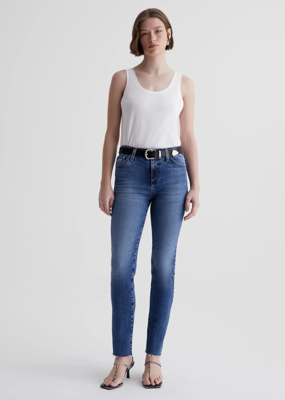 Zoomed out shot of model wearing the Mari High Rise Slim Straight Jean from AG Jeans.